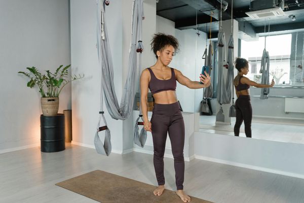 Person practicing yoga in modern setting.